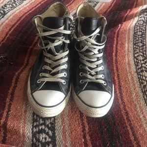 Black leather Converse High tops.